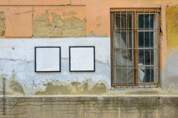 Fototapeta blank frame on a cracked concrete vintage brick wall background with old window 