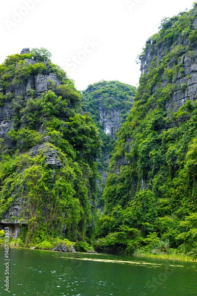Fototapeta Ninh Binh, Vietnam - July 18, 2022 : Beautiful Natural Landscape In Trang An Landscape Complex Of Ninh Binh Province, Vietnam. Trang An Area Was Designated As A Dual UNESCO World Heritage Site.