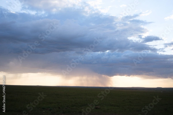 Fototapeta clouds over the field