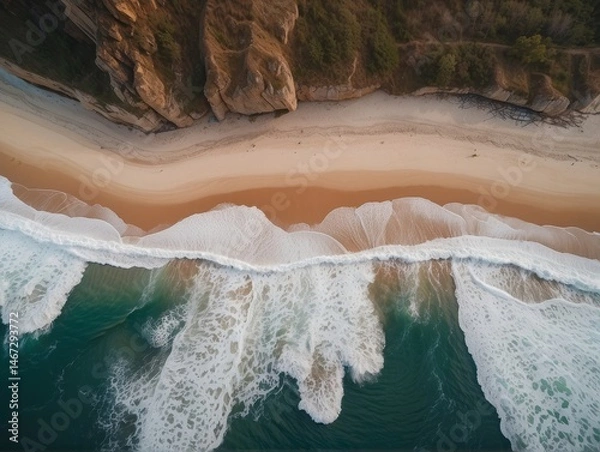 Fototapeta A mesmerizing aerial top-view photograph capturing the spectacular dance of ocean waves