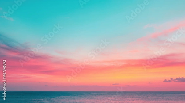 Fototapeta A serene seascape featuring vibrant hues of pink and turquoise as the sun sets, creating a tranquil atmosphere.