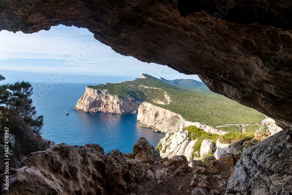 Fototapeta Coastal cliff and sea view from rocky cave at Capo Caccia