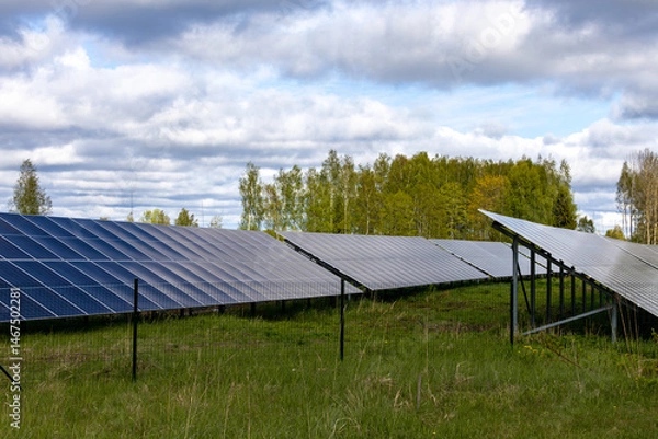 Fototapeta Kuldiga, Latvia An Array of solar panels in a field.