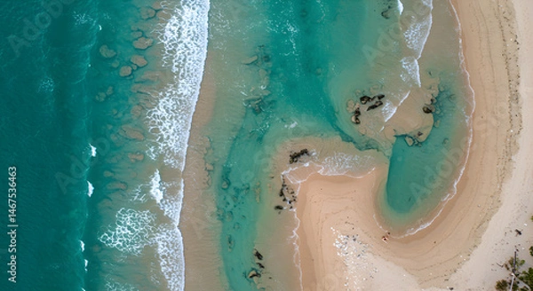 Fototapeta Aerial View of Waves Crashing on Sandy Beach Shoreline