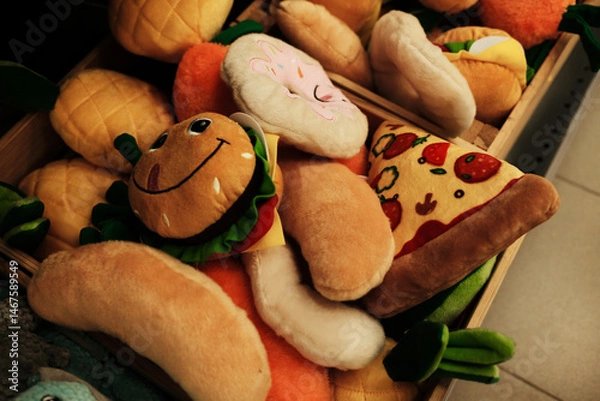 Obraz Plush dog toys shaped like funny food items including pizza, hamburger, donut, and hot dog. Soft and colorful ideal for playful pets and perfect for promoting pet products or accessories.