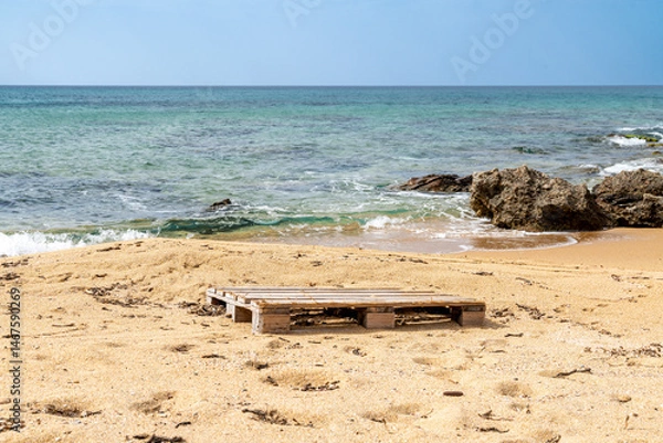 Fototapeta Wooden Pallet on Sandy Portu Maga Beach Shore