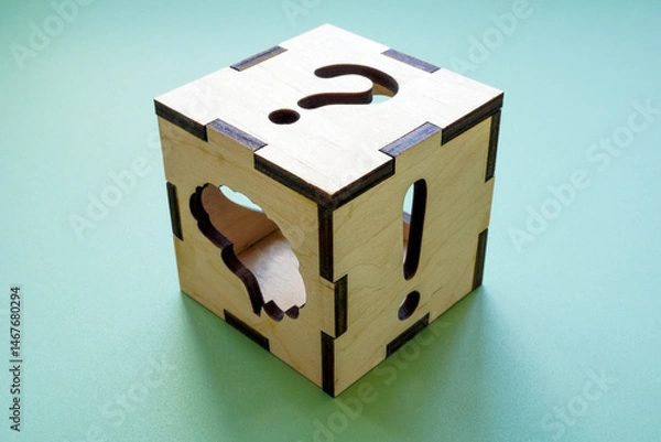 Obraz Cube with question mark, exclamation mark and brain symbolizing cognitive processes.