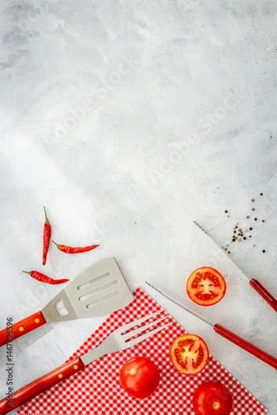 Obraz Set with barbecue utensils and equipment with red picnic napkin. Stainless steel tools. Top view