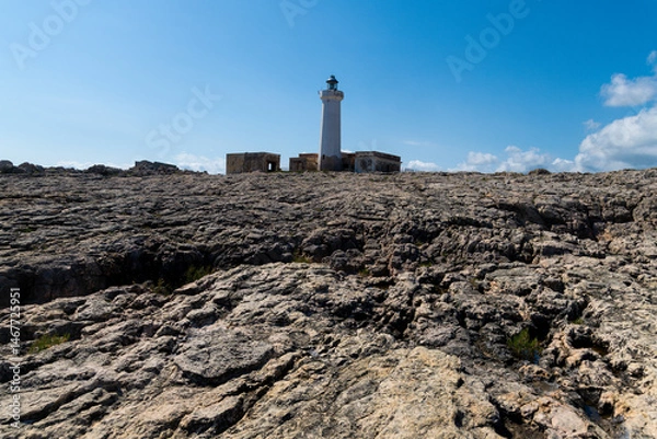Fototapeta Lighthouse on wide rocky terrain near Syracuse