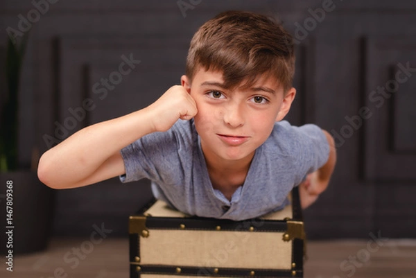 Fototapeta kid playing superman on a house setting 
