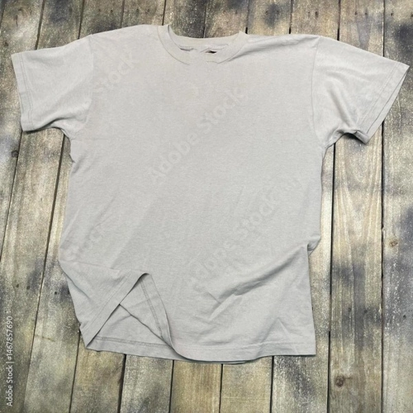 Obraz Vintage style t-shirt mockup with an aged 90s look stretched on rustic wood