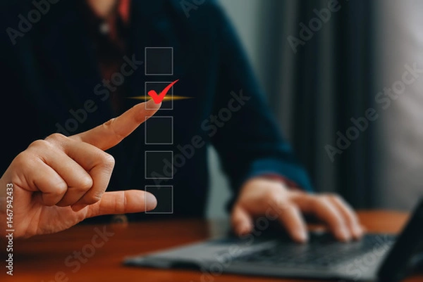 Obraz Checklist concept. Businessman using laptop tick correct mark in checkbox on virtual screen.