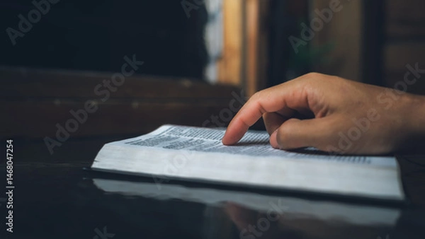 Obraz Close up of a man reading the Bible Spiritual concepts by studying the Holy Scriptures together, devotional concept