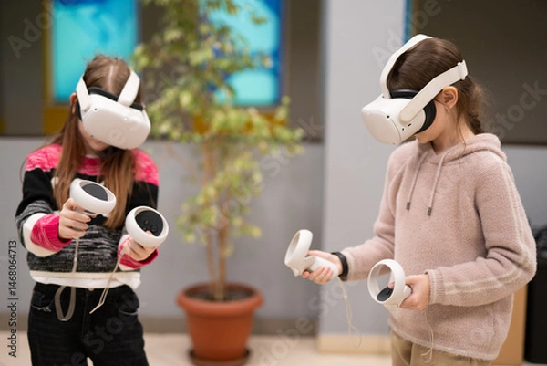 Fototapeta a child in virtual reality glasses plays a game