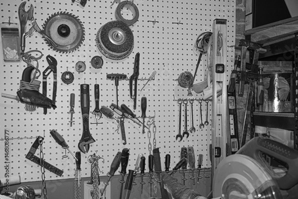 Fototapeta Storage area in the basement workbench with tools and miscellaneous items.