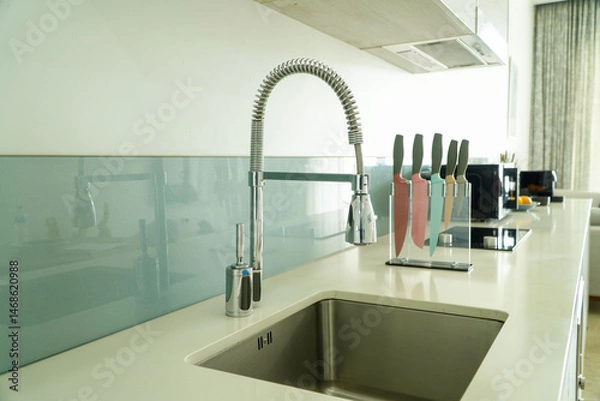 Obraz Modern kitchen faucet and sink with kitchen knife set,filter effect
