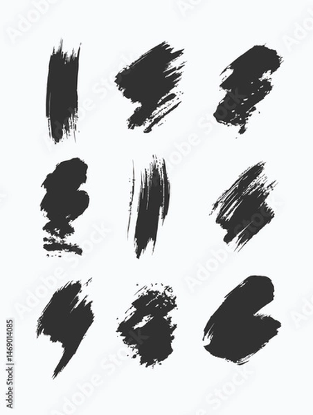 Fototapeta Black paint strokes on a white canvas create an abstract background.