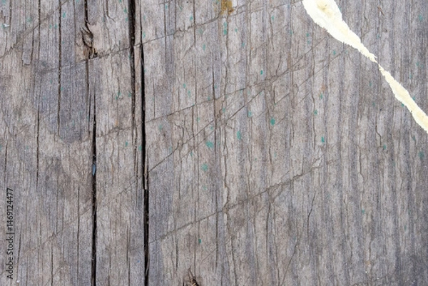 Fototapeta The texture of an old gray board covered with cracks