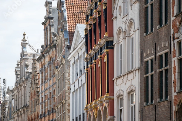 Obraz Medieval houses facades and rooftops and city tower with bells in the centre of Bruges, Flanders