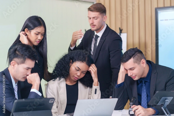 Obraz frustrated multiracial business people seriously meeting in office room,bad condition business conference,problem,worry of results business crisis