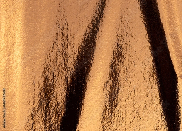 Obraz Golden and bronze foil texture with a glossy, shiny finish, creating a sleek, luxurious backdrop.