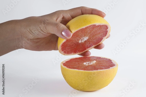 Obraz Holding a grapefruit