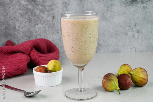 Obraz Fig milkshake in a glass cup.