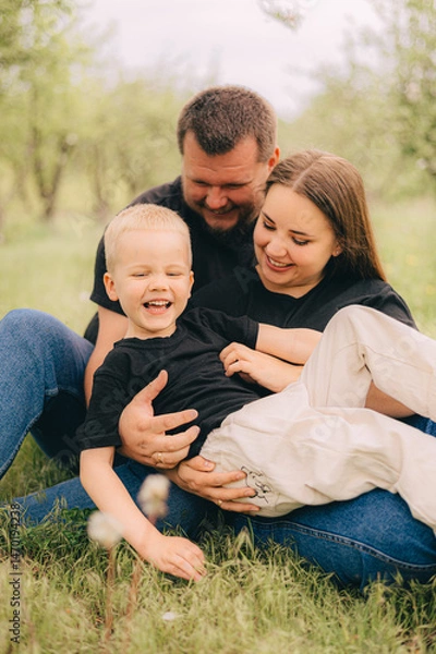 Obraz Family Portrait in Outdoor Setting with Smiling Faces