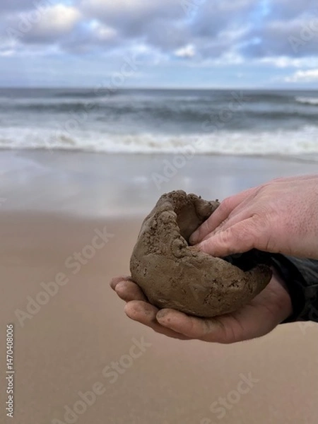 Obraz Pottery hands on the beach