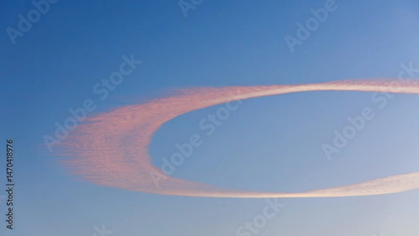 Fototapeta Beautiful patterns in the sky left by a passing airplane