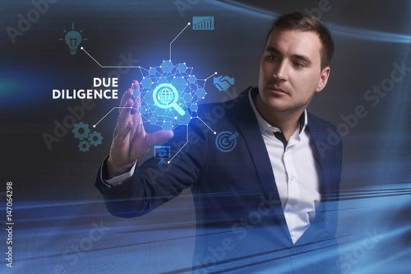 Fototapeta Business, Technology, Internet and network concept. Young businessman working on a virtual screen of the future and sees the inscription: Due diligence