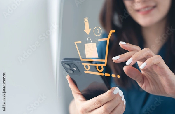 Obraz Online shopping, e-commerce, social media marketing, global business concept. Customer using mobile phone for online shopping via mobile app with virtual shopping cart, small business