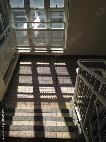 Obraz Sun rays from the window in the stairway. Soft lines from sun rays on the floor. Abstract background. Light background with sun rays. Soft focus.