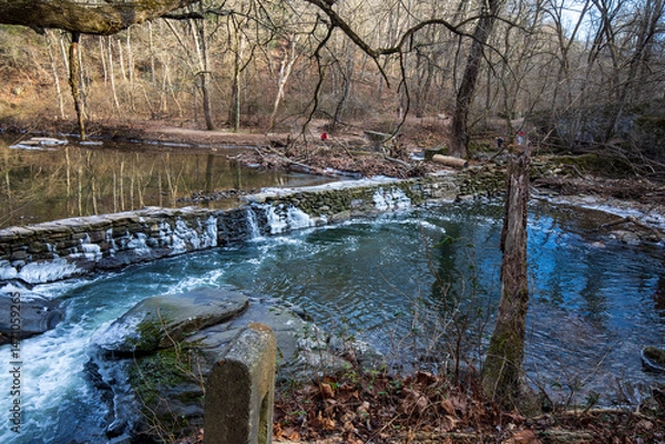 Obraz Wissahickon,Pennsylvania,USA - December 14 2022: Magarge dam at Wissahickon Trails in winter.
