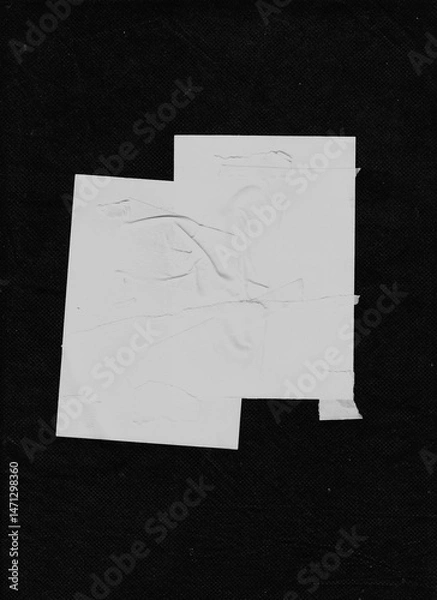 Fototapeta Scattered white paper strips forming dense diagonal and horizontal patterns over black fabric. Clean, modern, and dynamic layout for abstract visual design.
