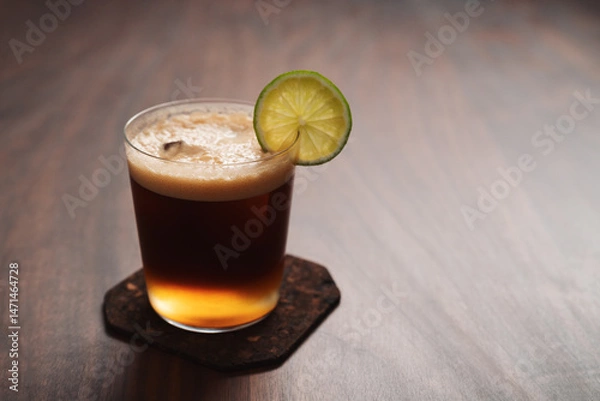 Obraz Espresso tonic in simple glass on walnut wood table with copy space