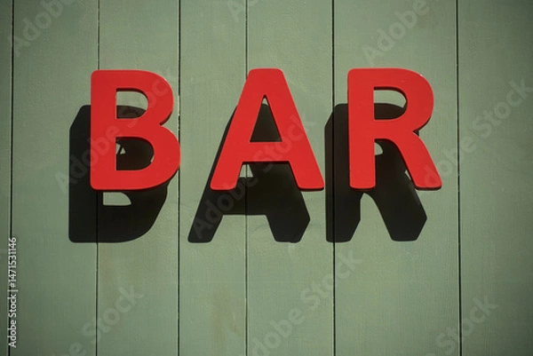 Obraz Closeup of bar signage on the wall in the street