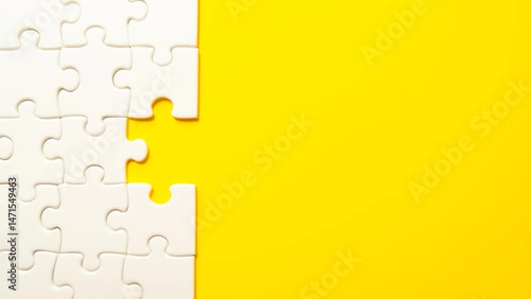 Fototapeta White Puzzle Pieces on Bright Yellow Background with One Piece Missing