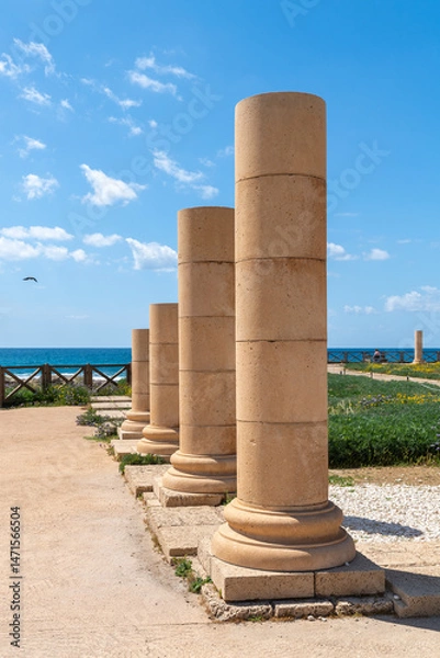 Fototapeta Columns in the ancient ruins of Caesarea at the edge of the Mediterranean Sea in Caesarea, Israel.
