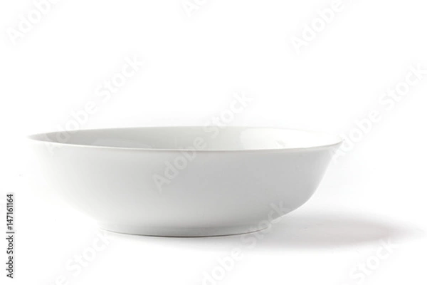 Fototapeta White wide salad bowl from side on a white background