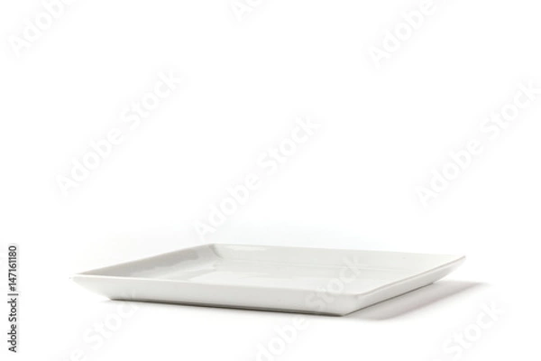 Fototapeta Side view of square white plate