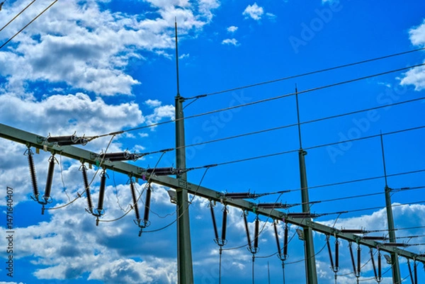 Fototapeta Power poles in spring on the field and meadow, Brandenburg, Germany