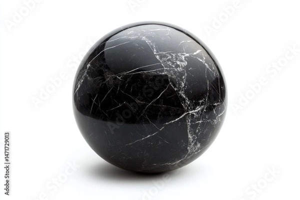 Fototapeta A glossy, dark marble sphere with striking white veins sits against a stark white backdrop, showing off polished texture.