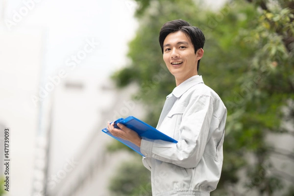 Fototapeta 作業服を着た男性