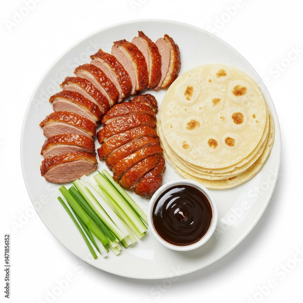 Fototapeta Thinly sliced peking duck with crispy skin, cucumber, scallions and hoisin sauce with pancakes, white plate isolated on white