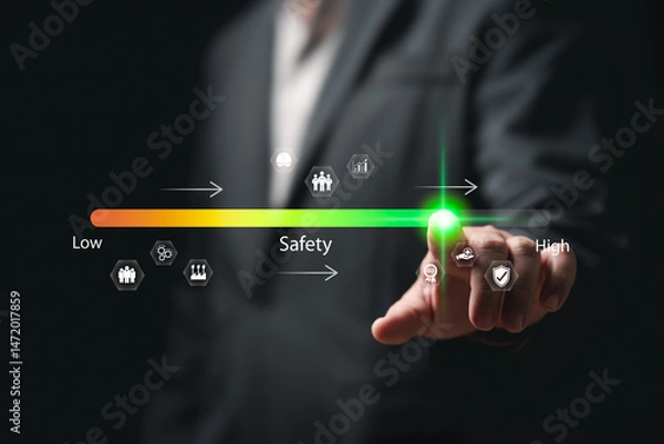 Obraz Safety, Risk Assessment concept, Businessman touch on safety level, Safety awareness comes first, Compliance, Security, Regulations standards in industry, Travel, Health protection, Personal security
