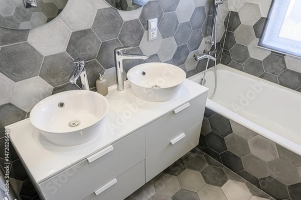 Fototapeta Modern bathroom with hexagon tiles, double vanity, round sinks, and a bathtub. Clean, contemporary design