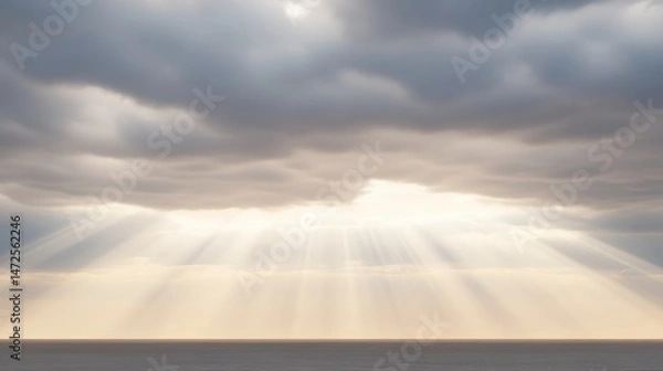 Fototapeta Tranquil Ocean View with Sunlight Breaking Through Cloudy Sky