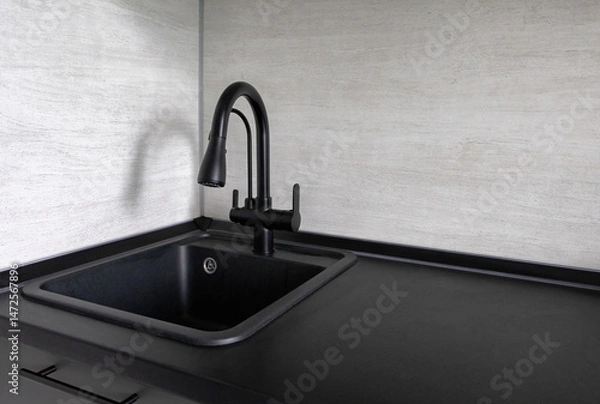 Fototapeta Stylish countertop with sink, faucet, filter, and backsplash