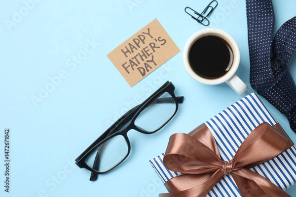 Obraz Happy Father's Day flat lay concept. Top view photo of giftbox with silk ribbon bow, cup of coffee, glasses, elegant tie on color background
